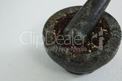 Black pepper in mortar and pestle