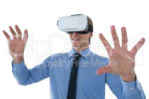 Businessman gesturing while wearing futuristic headset