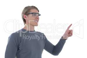 Smiling businessman gesturing while wearing smart glasses