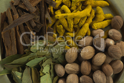 Nutmeg, bay leaf, cinnamon stick and turmeric
