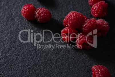 Raspberries on black background