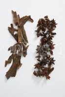 Star anise and cinnamon sticks on white background