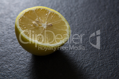 Halved lemon on black background