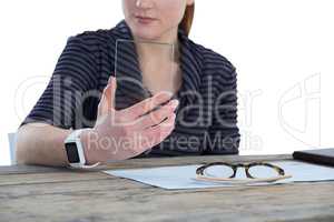 Mid section of businesswoman using glass interface