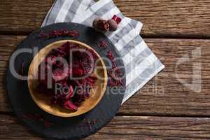 Dried beetroot in wooden plate