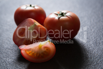 Tomatoes on black background