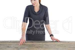 Businesswoman touching wooden table