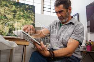 Man painting in drawing book