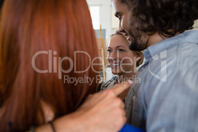 Close up of cheerful friends huddling