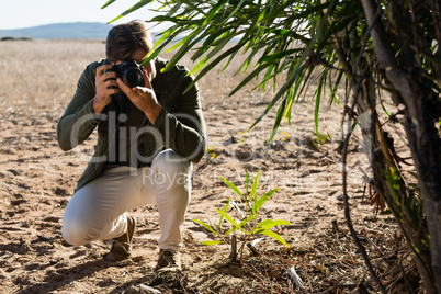 Man photographing on landscape
