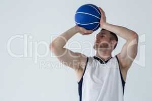 Determined player holding basketball