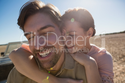 Happy couple with eyes closed on landscape