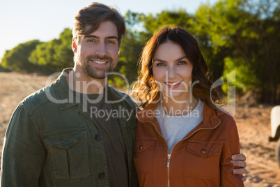 Portrait of couple on field