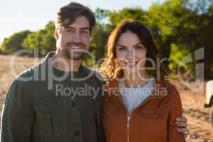 Portrait of couple on field