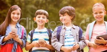 Composite image of portrait of children holding mobile phones