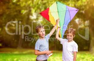 Composite image of portrait of boys with colorful kite