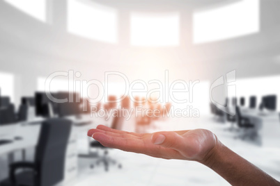 Composite image of hand of man pretending to hold an invisible object