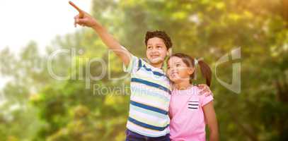 Composite image of boy with sister pointing