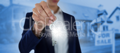 Composite image of mid section of businesswoman showing house key