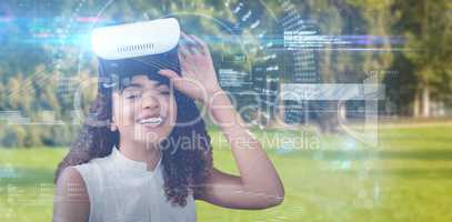 Composite image of portrait of happy young woman with virtual reality simulator