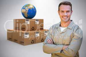 Composite image of confident delivery man standing with arms crossed