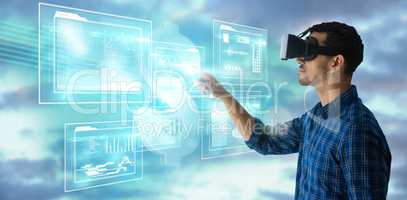 Composite image of side view of businessman gesturing while looking though virtual reality simulator