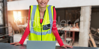Composite image of portrait of confident female architect wearing reflective clothing