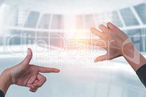 Composite image of businesswoman holding invisible card