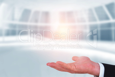 Composite image of businessman with wrist watch and hands out