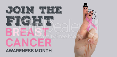 Composite image of cropped hand with pink breast cancer awareness ribbon