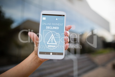 Composite image of online payment text on blue mobile display