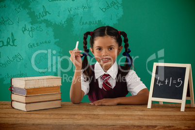 Composite image of graphic image of text on blue chalkboard