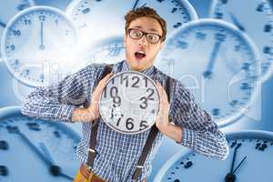 Composite image of geeky businessman holding a clock