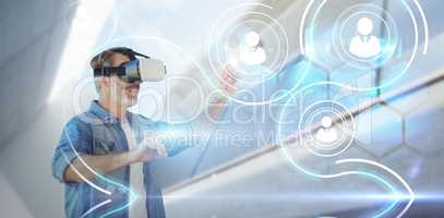 Composite image of smiling businessman looking though virtual reality simulato