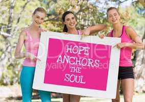 Hope anchors the soul text and pink breast cancer awareness women holding card