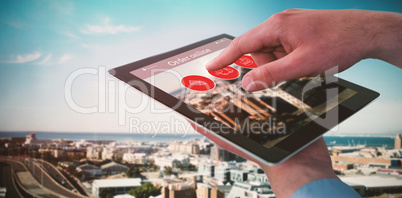 Composite image of croped hands of businessman using digital tablet