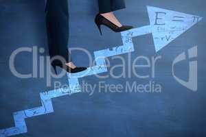 Composite image of conceptual image of businesswoman in heels climbing steps