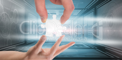 Composite image of hands holding jigsaw