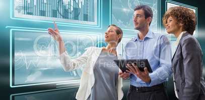 Composite image of businesswoman pointing while explaining with colleagues against white background