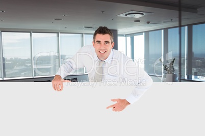 Business man holding blank card in office