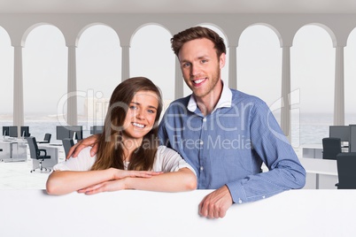 Business people holding blank card in office