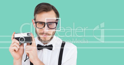 man with eye focus box detail over glasses holding camera and lines