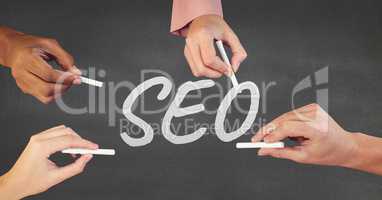 Hands interacting with SEO business text against grey background