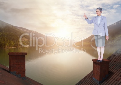 Businesswoman standing on Roofs with chimney and lake mountain landscape