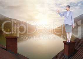 Businesswoman standing on Roofs with chimney and lake mountain landscape