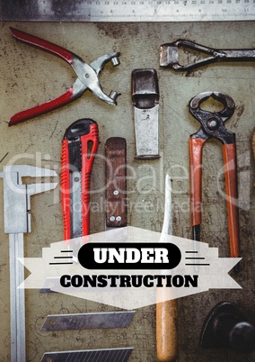 Under construction text against tools photo