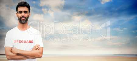 Composite image of portrait of male lifeguard with arms crossed