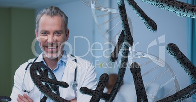 Happy doctor man with 3D DNA strands