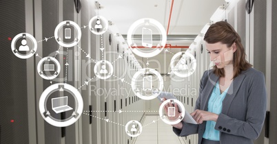 Business woman holding a tablet and graphics in server room