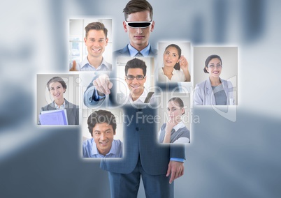 Businessman wearing Virtual reality headset interacting and choosing a person from group of people i